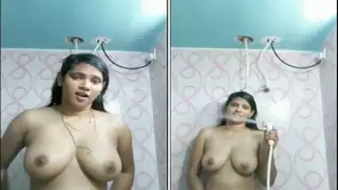 Indian girl with juicy melons satisfies pussy in the shower room